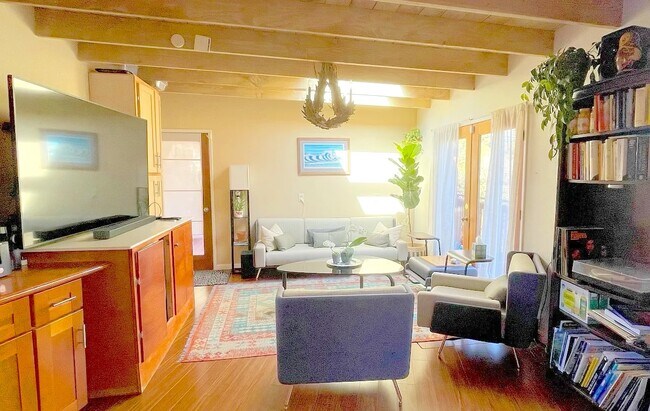 Second living room / den area on first floor with doors out to deck overlooking Soquel creek. - 3560 Paper Mill Rd