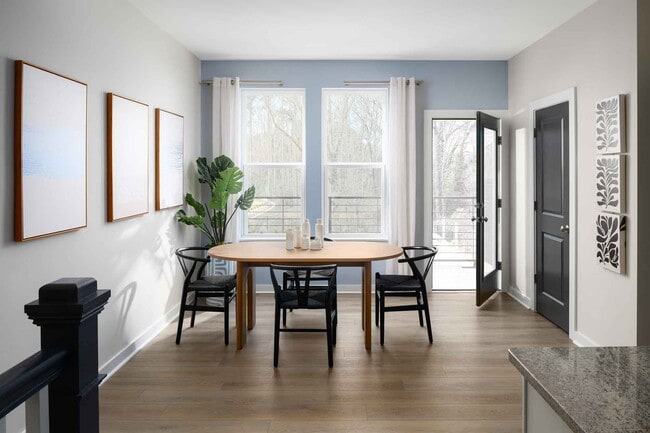Natural light pours into the dining area, with easy access to the private walk-out balcony - 1421 Lithium Ln