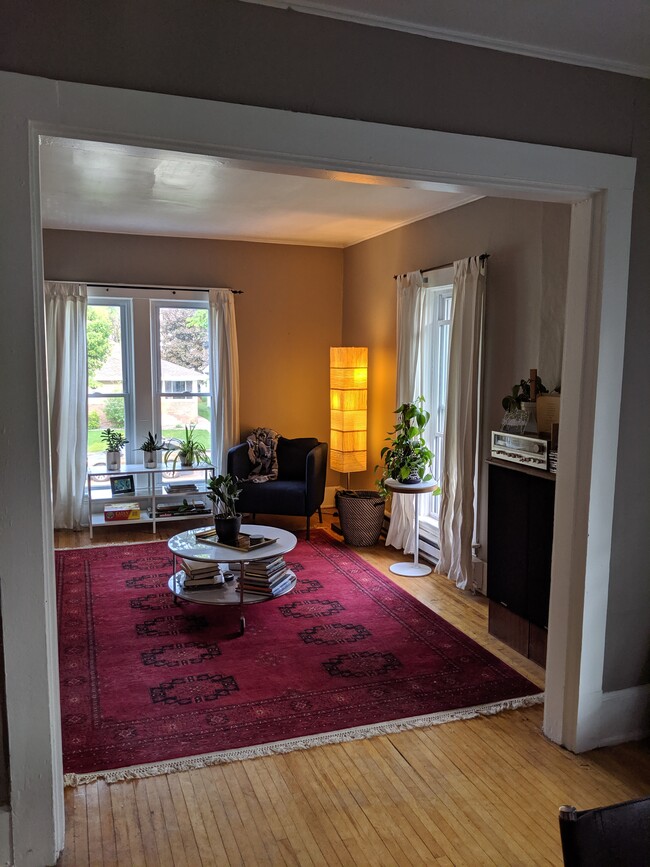 The well-lit living room with east and south-facing windows. - 2526 NE Taylor St