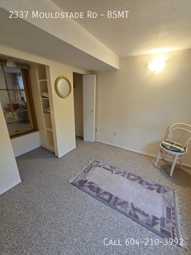 Photo du bâtiment - Cozy Basement Suite - Utilities Included