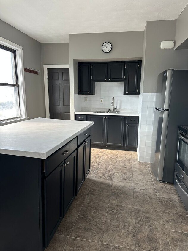 Building Photo - Spacious three-family property on Charles Street in North Providence