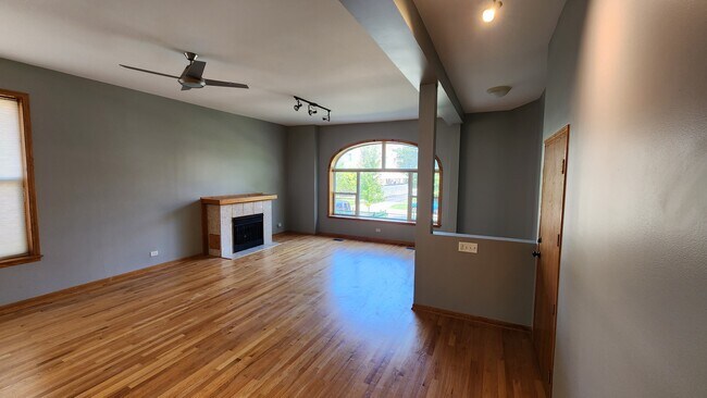 Large sunny living room and front entry - 6126 S University Ave