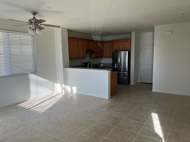 Building Photo - MODERN LIVING WITH TILE FLOOR DOWN AND NEW CARPET UP. OPEN FLOOR PLAN AND HIGH CEILINGS!!!