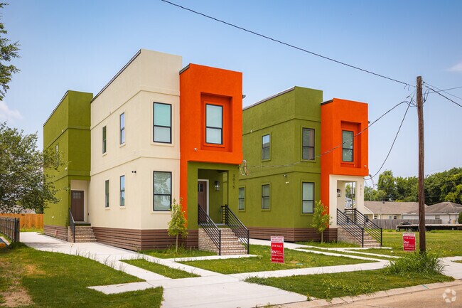 Newly built modern residences keep to the narrow lots iconic of shotgun homes in Behrman.