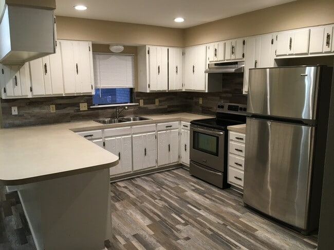 Large open kitchen with lots of cabinets and countertops - 10845 Eastwood Dr