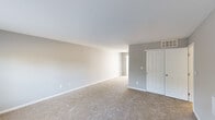 Located at 437 Sunburst Dr in Delaware, Ohio, this two-story, two-bedroom, four-bathroom home offers a well-organized layout distributed evenly across both levels. The main floor welcomes you through a front entry door with sidelight windows, opening into a bright, carpeted living room bathed in natural light from large windows with blinds. A staircase with white railings leads to the upper level. The kitchen is efficiently designed with warm wood cabinetry, granite-style countertops, hardwood-style flooring, and black appliances including a refrigerator, gas range, built-in microwave, and dishwasher. The bathrooms feature tile flooring in neutral tones and warm wood vanities. Upstairs, the generously sized primary bedroom includes its own en-suite bathroom and a spacious walk-in closet outfitted with wire shelving and hanging rods. The second bedroom is carpeted with a large window providing ample natural light. A dedicated laundry room with wire shelving and a dryer hookup adds everyday convenience. Throughout the home, a consistent neutral gray and beige color palette, clean white trim, and carpeted living areas create a cohesive, move-in-ready aesthetic.