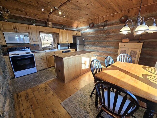 Building Photo - Beautifully Furnished Log Cabin in Paved S...