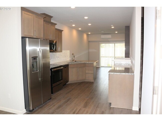 Building Photo - Modern 3-Bedroom Townhome-Style Home with Attached Garage, Private Patio & En-Suite Bathrooms in ...