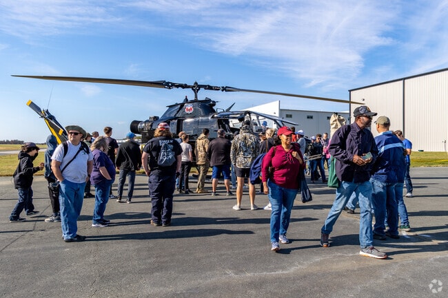 Military pilots answer questions about their aircraft at Warbirds Over Monroe.