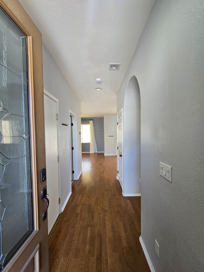 Building Photo - Step outside to a spacious, larger-than-average Las Vegas backyard complete with lush artificial ...