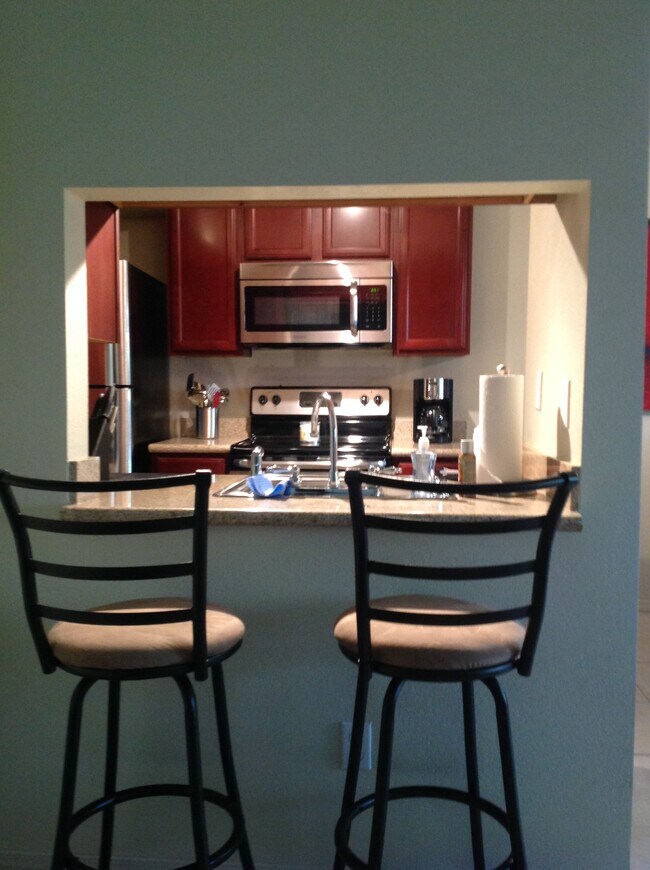 Kitchen and bar stool area - 3500 N Hayden Rd
