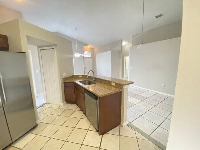 Building Photo - 3 Bed 2 Bath Home with Stainless Steel Appliances Near Poinciana Pkwy!