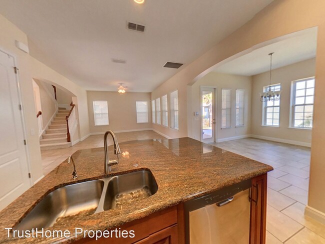 Building Photo - 4 br, 3.5 bath House - 8453 Laureate Blvd