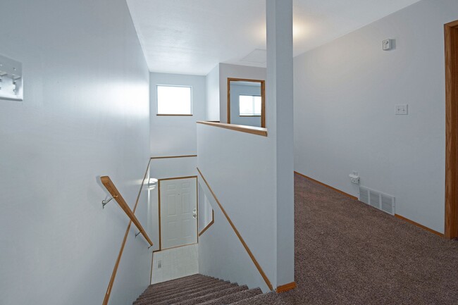 The hall between bedroom next to the stairs leading down to the first level - Willow View