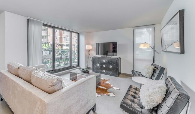 Spacious living room with access to private patio or balcony - Yorktown Apartment Homes