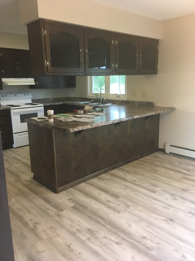 Large kitchen and dining room make cooking and entertaining so much fun. - 2305 Ash Ave Nw