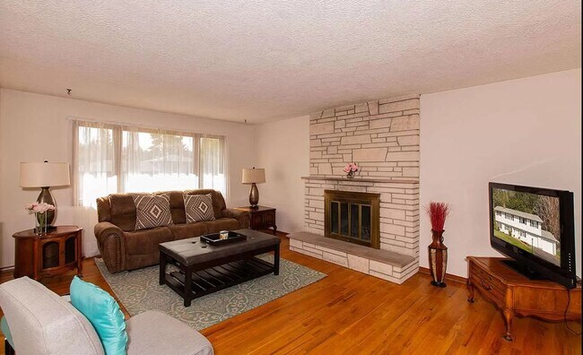 Living room, top of stairs - 8205 N Jefferson Dr