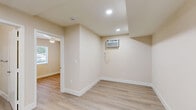 Located at 1147 W Linden St in Riverside, CA, this 2-bedroom, 1-bathroom unit offers a clean, modern design across a single floor. Light wood-style flooring runs throughout the space, complementing the warm, neutral beige walls and crisp white trim that give the interior a bright, cohesive feel.

The spacious primary bedroom is generously sized, featuring a ceiling fan, a large sliding-glass window that invites natural light, and direct access to the shared bathroom. The second bedroom is cozy and well-lit, with windows fitted with slatted blinds offering views of the surrounding area and ample natural light.

A third room, visible from the hallway, includes a built-in sliding-door closet and a large window with outdoor views — ideal for use as a bedroom, office, or flex space.

The bathroom is outfitted with a full tub-shower combo featuring white subway tile surround and brushed nickel fixtures, paired with a standard toilet in a clean, well-maintained layout.

The hallway connects all rooms efficiently, with clear sightlines and an open feel despite the compact footprint. Throughout the unit, the consistent use of light tones, smooth walls, and updated finishes creates a fresh, move-in-ready environment suited for comfortable everyday living in Riverside.