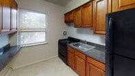 Located at 60 Woodbridge Ave in Highland Park, NJ, this 2-bedroom, 1-bathroom unit offers a practical and well-organized single-floor layout. Rich, polished hardwood floors run throughout the living areas and bedrooms, lending warmth and character to the space. The living room is comfortably sized, featuring baseboard heating, a wall-unit air conditioner, and windows that allow natural light to fill the room.

Both bedrooms echo the same hardwood flooring and clean white walls, each equipped with windows for ventilation and natural light. One bedroom includes a wall-unit air conditioner, while the other benefits from baseboard heating, ensuring year-round comfort.

The kitchen is appointed with warm-toned wooden cabinetry, dark granite-style countertops, a stainless steel sink, and a black gas range. A window above the counter brings in natural light and views of the outdoors. The layout maximizes storage with both upper and lower cabinets.

The bathroom is finished with light tile flooring, a wooden vanity with storage, a toilet, and a full shower-tub combination beneath a window that provides ventilation. The overall design of the unit is clean and straightforward, offering a comfortable and functional living environment in Highland Park.