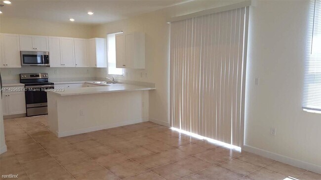 Building Photo - 4 br, 3 bath House - 10554 W 35th Ln