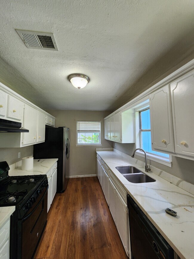 Kitchen Area with double Windows. Plenty of lights - 8137 Snowden St