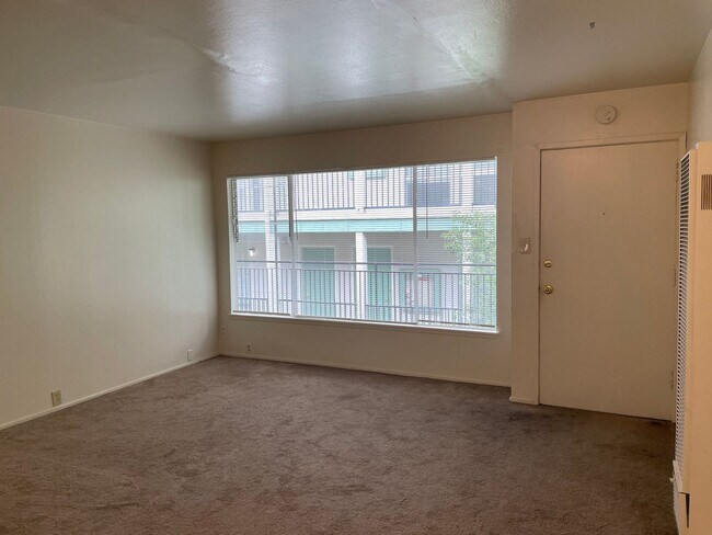 Building Photo - Updated Kitchen & Bathroom with New Flooring - Top Floor Unit with Fresh Paint