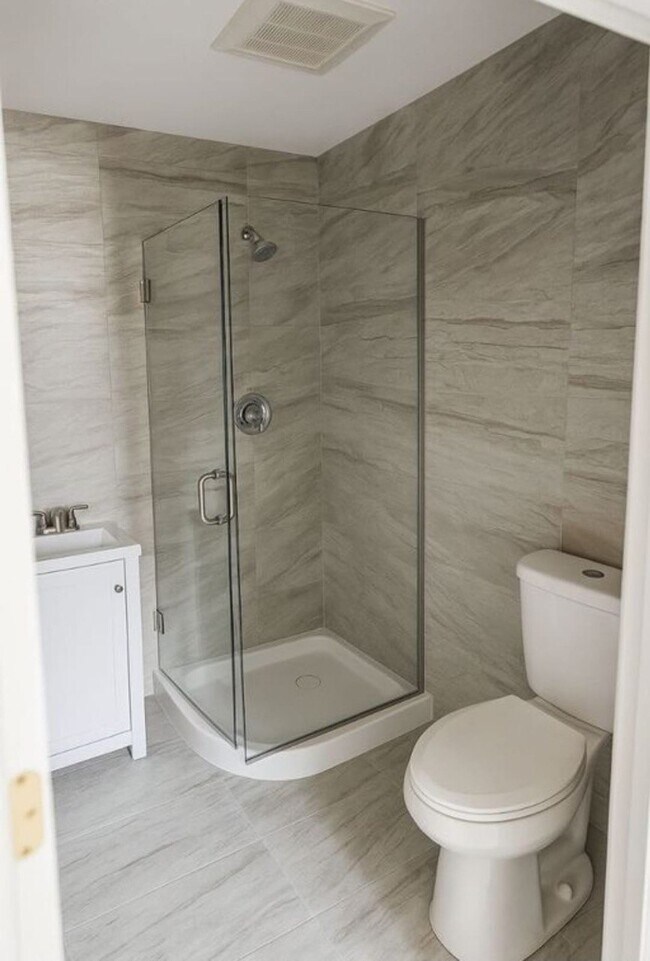 renovated bathroom, featuring updated plumbing fixtures and modern finishes. Clean lines, quality ma - 2578 W 18th Pl