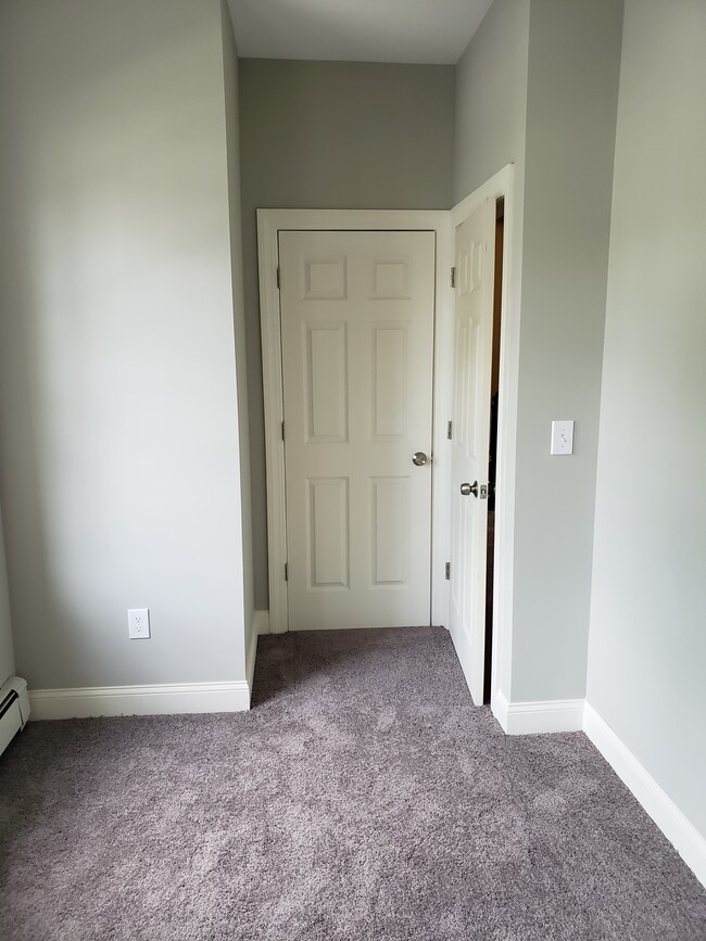 Bedroom #3, measures approx. 10 ft by 7 ft. Bedroom has two windows. Contains a closet. - 2 Judson St