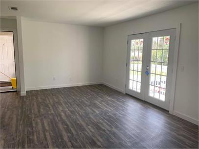 Upstairs (units C & D) living room has balcony doors, downstairs living room does not. - 2503 W 10th St