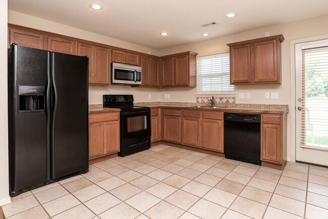 Photo - Appliances Included! House