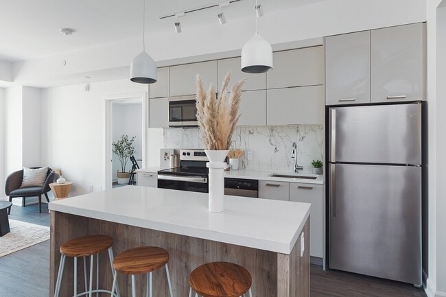 Building Photo - Brand New 1 Bed + Den in Boutique Building...