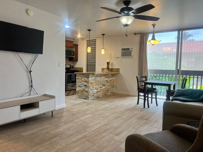 Building Photo - One bedroom semi-furnished bottom floor condo