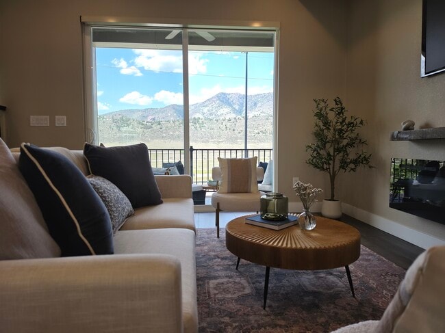 Living room blends seamlessly into patio with mountain views - 2220 S McIntyre St Townhome