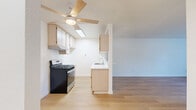 This 620 square foot apartment in Los Angeles offers a well-designed living space with modern amenities. The single-level layout comprises one bedroom, two bathrooms, and an open-plan kitchen and living area. The primary bedroom, measuring 140 square feet, provides ample space for rest and relaxation.

Throughout the apartment, light wood flooring creates a warm and inviting atmosphere, complemented by crisp white walls that enhance the sense of space and brightness. The living area features a stylish ceiling fan with wooden blades, adding both functionality and aesthetic appeal. Large windows and sliding glass doors invite natural light and offer views of the surroundings.

The kitchen boasts light wood cabinetry, stainless steel appliances, and white countertops, creating a clean and contemporary look. It's equipped with a gas range, dishwasher, and ample storage space. The bathrooms are modern and functional, with one featuring a bathtub-shower combination.

The apartment's efficient design maximizes the use of space, with built-in storage solutions and a layout that promotes easy flow between rooms. The neutral color palette and minimalist design elements create a versatile canvas for personal decorating styles. Located at 16820 Chatsworth St, this apartment offers a perfect blend of comfort and convenience in the heart of Los Angeles.