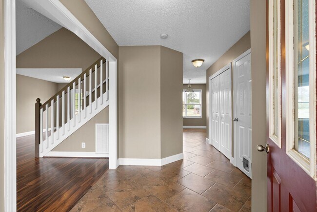 Building Photo - Pet-Friendly 3BR Home w/ 3-Car Garage, Fir...