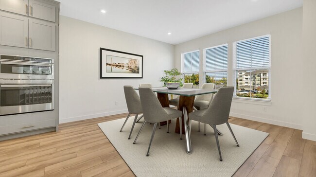 Dining area shown with virtual staging. Staging not included in listing. - 16531 Yellowwood Dr
