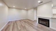 Located in Fair Oaks, California, this well-appointed single-story, one-bedroom, one-bathroom unit offers a clean, modern aesthetic throughout its efficiently arranged floor plan. Light wood-style laminate flooring flows through the main living areas, complementing the neutral, warm-toned walls and crisp white baseboards that give the space a bright and cohesive feel.

The living room serves as a welcoming centerpiece, highlighted by a classic fireplace with a clean white mantle, recessed lighting, and a ceiling vent — creating a comfortable and inviting atmosphere. Adjacent to the living area, the galley-style kitchen is well-equipped with white shaker cabinetry, a stainless steel sink, and black appliances including a refrigerator, range, and dishwasher. A window at the end of the kitchen allows natural light to fill the space.

The bedroom features plush carpeting, a ceiling fan with integrated lighting, and a window with blinds that filters in soft natural light. A dedicated closet provides convenient storage. The bathroom is finished with a wide vanity topped with a stone-look countertop, a large mirror, a full tub and shower, and matching light wood-style flooring. A separate closet room adds additional storage flexibility to this smartly designed home.