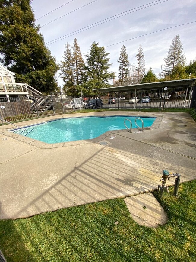 Photo - Bright Vaulted-Ceiling Condo in Gated Community • Pool • W/D Included • Move-In Ready
