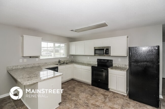Building Photo - 9977 Chariden Dr