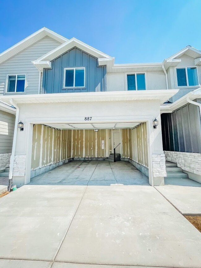 Building Photo - Brand New Idyllic Townhome in AF