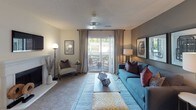 Located at 7930 Vinings Oak Ln in Matthews, NC, this single-floor residence offers a thoughtfully designed layout that balances comfort and functionality throughout. The living room serves as the heart of the home, featuring a warm, neutral color palette with a taupe accent wall, plush carpeting, and a sliding glass door that opens to a private balcony — flooding the space with natural light and providing pleasant outdoor views. The kitchen is outfitted with white cabinetry, ample counter space, and hardwood-style flooring, offering an efficient and clean workspace. Adjacent to the kitchen, a dedicated dining area features a cozy layout with a closet for added storage convenience. The primary bedroom is generously sized, with large windows dressed in elegant curtains, soft carpeting, and a rich plum accent wall that creates a warm, inviting atmosphere. A second bedroom offers its own character with a slate-blue accent wall, built-in shelving, and natural light streaming through a well-positioned window. Both bathrooms are finished with hardwood-style flooring, white tile surround tub-shower combinations, and clean, bright aesthetics. Throughout the residence, consistent textured ceilings, neutral tones, and carefully considered design details create a cohesive and welcoming ambiance.