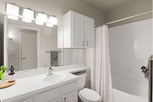 Renovated Bathrooms with New Vanities, Countertops, and Lighting - Creekside 121