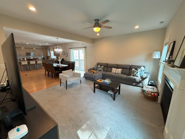Main floor, living room and dining room open floor concept. Carpet and hardwood flooring. - 140 Wells View Rd