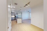 Located at 17011 W Little York Rd in Houston, TX, this single-story, 1-bedroom, 2-bathroom home offers a thoughtfully designed open-concept floor plan. Light hardwood flooring flows throughout the main living areas, creating a bright and cohesive aesthetic. The heart of the home is a well-appointed kitchen featuring gray shaker-style cabinetry, dark granite countertops, stainless steel appliances including a French door refrigerator, built-in microwave, and range, plus a central island with a sink and pendant lighting above. The kitchen opens seamlessly into the dining and living areas, which are bathed in natural light from large windows and equipped with ceiling fans. The spacious primary bedroom features plush carpeting, dual windows with outdoor views, a walk-in closet with built-in shelving, and a private en-suite bathroom with a dual-sink vanity, dark granite countertops, and a glass-enclosed shower. A second full bathroom includes a tiled tub-shower combination. Additional highlights include a dedicated laundry area, pantry, two closets, and a private patio — all contributing to a functional and comfortable living environment.