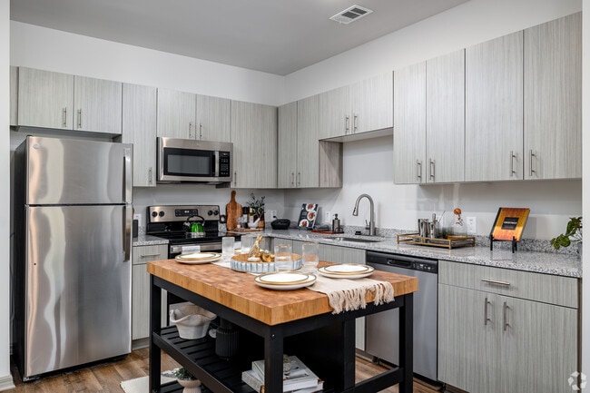 1BR, 1BA - 829SF - Kitchen with Island - Sweetwater Vista 1BR, 1BA - 829SF - Kitchen with Island - Sweetwater Vista