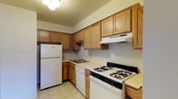 Located at 1475 Stimmel Road in Columbus, Ohio, this single-floor space offers a practical and well-organized layout designed for comfortable everyday living. The kitchen is a standout feature, showcasing warm oak cabinetry that lines the walls and provides generous storage throughout. Equipped with a gas range, white refrigerator, dishwasher, and a built-in range hood, the kitchen is fully outfitted for daily cooking needs. The countertops offer a solid work surface, and the double basin sink is positioned conveniently along the lower cabinetry run. The light-toned flooring ties the kitchen together and contributes to a clean, neutral aesthetic. Overhead lighting keeps the space well-lit, enhancing the functional design. The overall ambiance is straightforward and practical, with a focus on efficient use of space. The layout allows for easy movement throughout the kitchen, making meal preparation a seamless experience. Situated in Columbus, OH, this property is a solid option for those seeking a no-fuss, move-in ready space in a residential neighborhood.