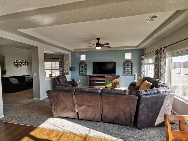 Large living room with lots of natural light - 17778 E 44th Ave
