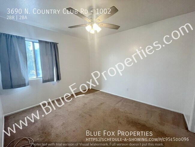 Building Photo - 3690 N. Country Club Rd #1002
