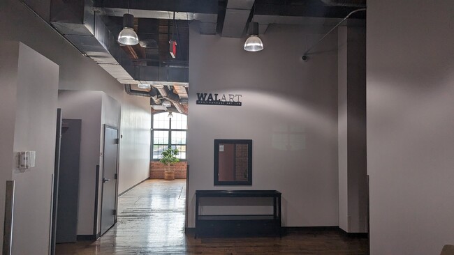 Photo - Luxurious 1bd condo , 15' Ceilings, exposed brick, in-unit laundry