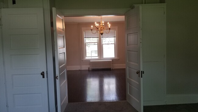 Bedroom #1 with parlor doors to dining room - 302 Summit Ave
